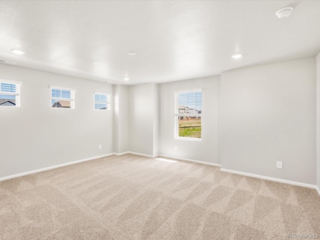 17487 E 89th Way, Commerce City, CO 80022 - carpeted empty room with baseboards and recessed lighting