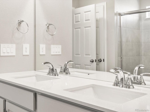 17487 E 89th Way, Commerce City, CO 80022 - bathroom featuring double vanity and a tile shower