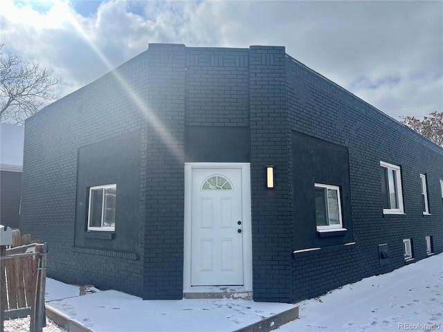 view of front of home featuring brick siding