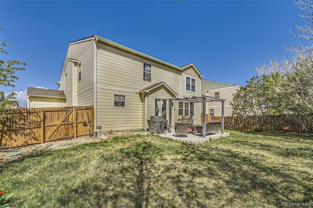 rear view of house with a pergola and a patio area