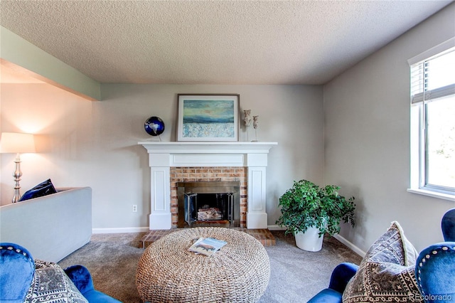 8538 W Glasgow Pl, Littleton, CO 80128 - carpeted living room featuring a fireplace, plenty of natural light, and a textured ceiling