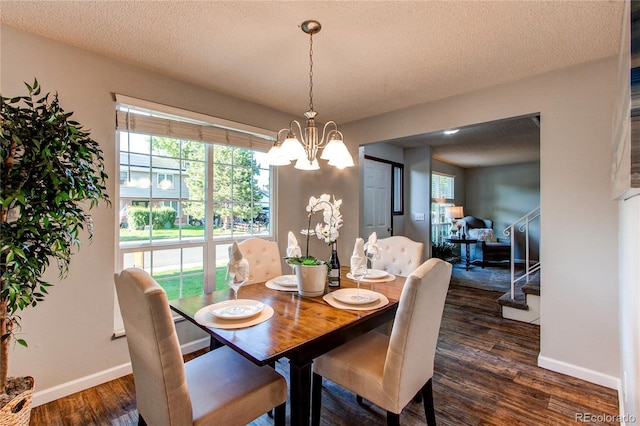 8538 W Glasgow Pl, Littleton, CO 80128 - dining space with a chandelier, dark wood finished floors, stairs, and a textured ceiling