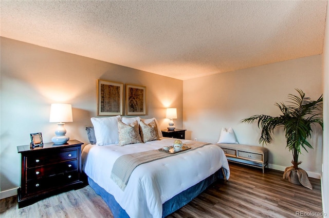 8538 W Glasgow Pl, Littleton, CO 80128 - bedroom with a textured ceiling and wood finished floors