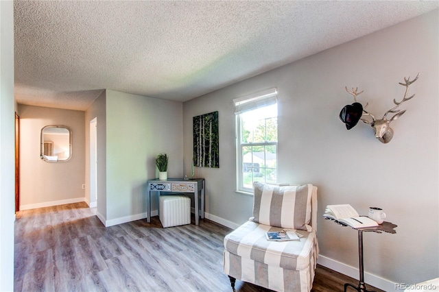 8538 W Glasgow Pl, Littleton, CO 80128 - living area with a textured ceiling and wood finished floors