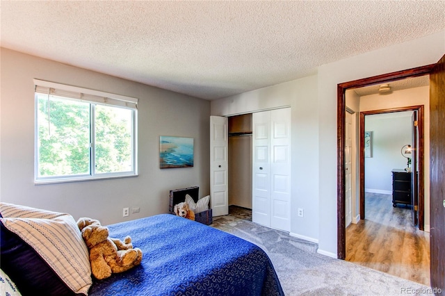8538 W Glasgow Pl, Littleton, CO 80128 - carpeted bedroom featuring a closet and a textured ceiling