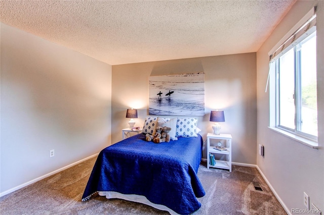 8538 W Glasgow Pl, Littleton, CO 80128 - bedroom featuring carpet floors and a textured ceiling