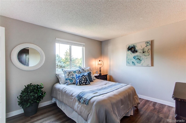 8538 W Glasgow Pl, Littleton, CO 80128 - bedroom with wood finished floors and a textured ceiling