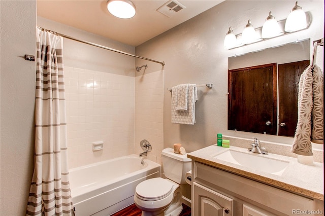 8538 W Glasgow Pl, Littleton, CO 80128 - full bathroom featuring vanity, shower / bath combo, and a textured wall