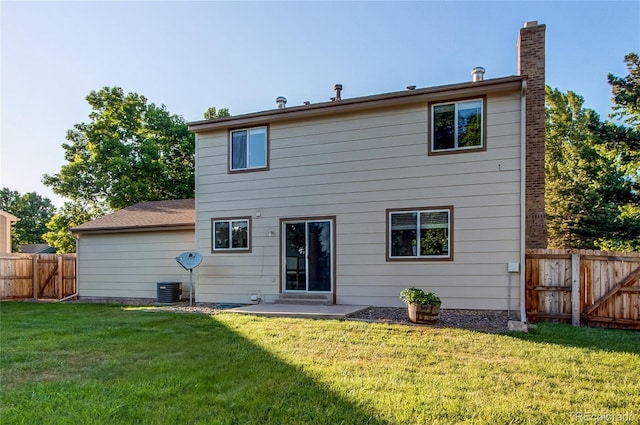 8538 W Glasgow Pl, Littleton, CO 80128 - rear view of property with a chimney, a fenced backyard, and a patio