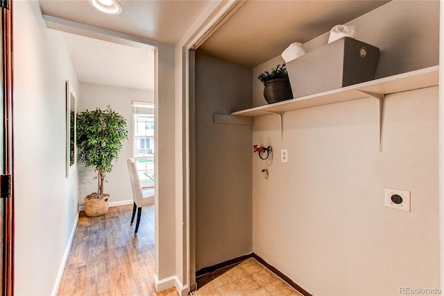 8538 W Glasgow Pl, Littleton, CO 80128 - laundry room featuring electric dryer hookup and light wood finished floors