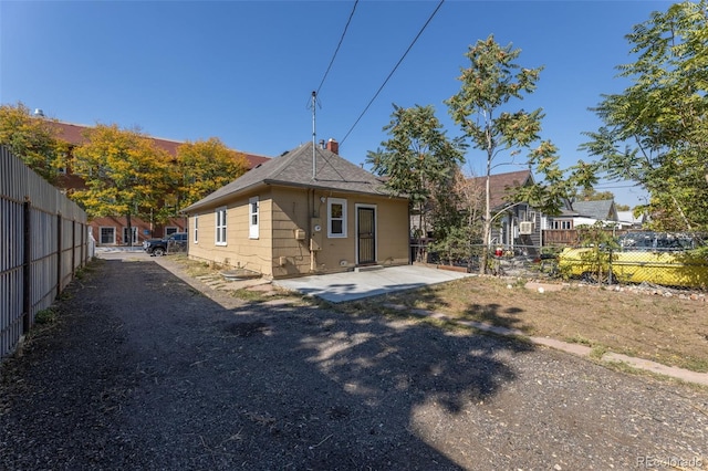 rear view of house with a patio