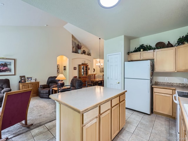 6626 S Reed Way Unit A, Littleton, CO 80123 - kitchen featuring white appliances, open floor plan, light tile patterned floors, light brown cabinets, and arched walkways
