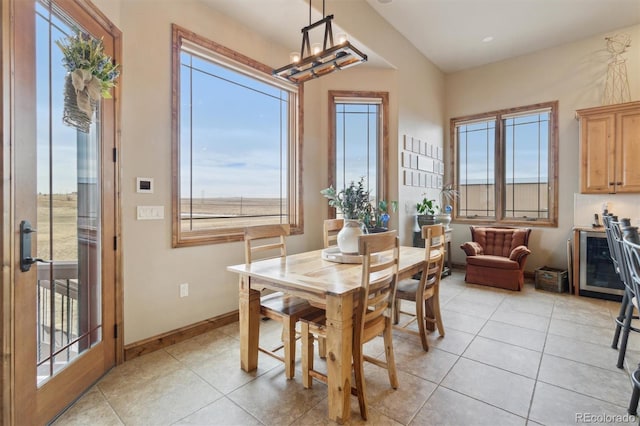 dining space with an inviting chandelier and light tile patterned floors