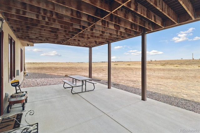 view of patio with a rural view