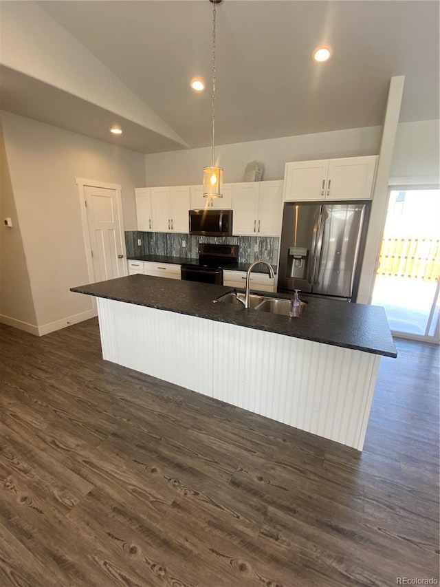 129 Red Tail Blvd, Buena Vista, CO 81211 - kitchen with a sink, electric range, stainless steel fridge, dark countertops, and vaulted ceiling