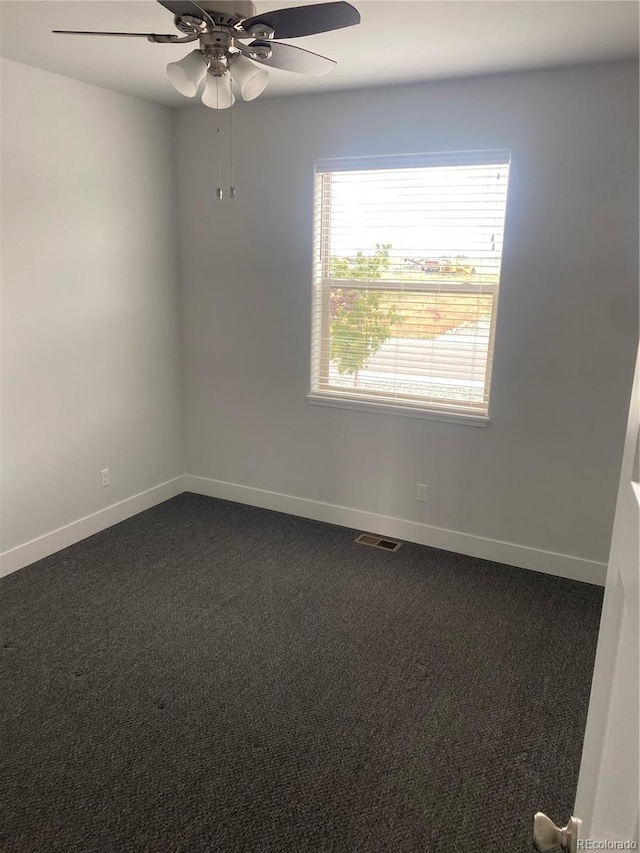 129 Red Tail Blvd, Buena Vista, CO 81211 - empty room featuring dark colored carpet, baseboards, and a ceiling fan