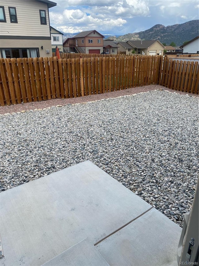 129 Red Tail Blvd, Buena Vista, CO 81211 - fenced yard featuring a patio area, a residential view, and a mountain view