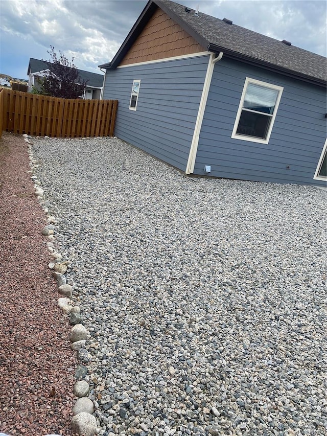 129 Red Tail Blvd, Buena Vista, CO 81211 - view of home's exterior with fence and roof with shingles