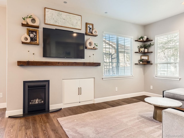 unfurnished living room with dark hardwood / wood-style flooring