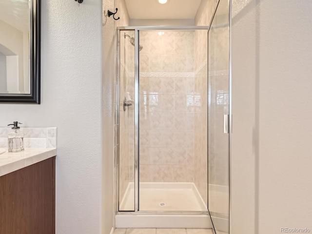 bathroom with vanity and walk in shower