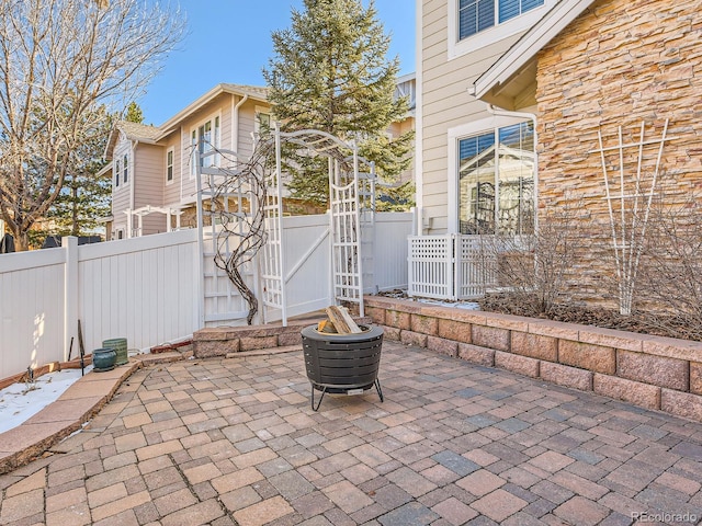 view of patio / terrace featuring a fire pit