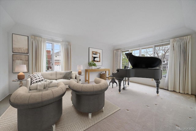 sitting room with carpet and lofted ceiling