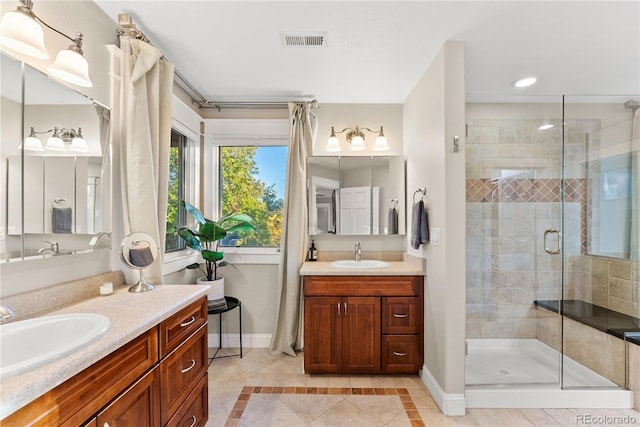 bathroom with two vanities, a sink, visible vents, and a shower stall