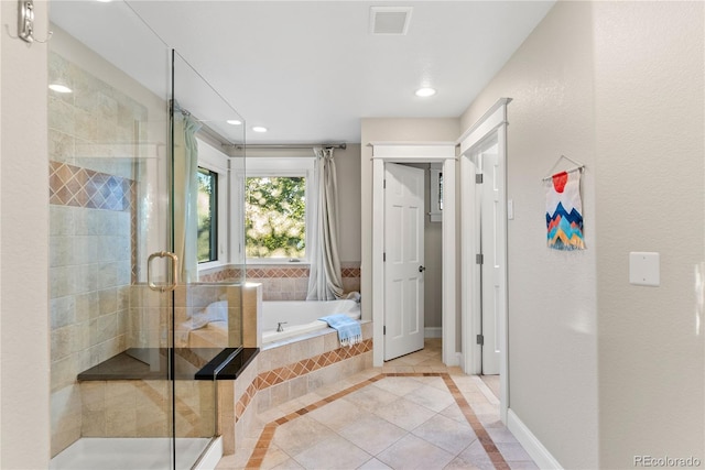 bathroom with visible vents, a stall shower, a bath, and recessed lighting