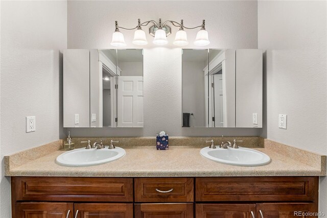 bathroom featuring double vanity and a sink