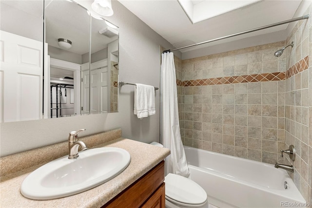 full bath with vanity, toilet, and shower / bath combo with shower curtain