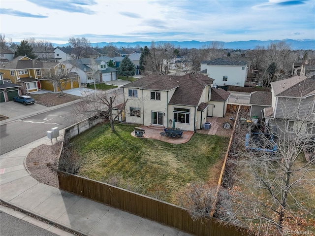 birds eye view of property featuring a mountain view