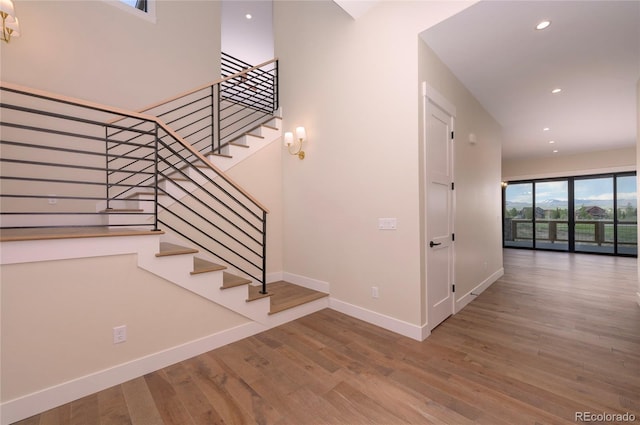 staircase with wood-type flooring