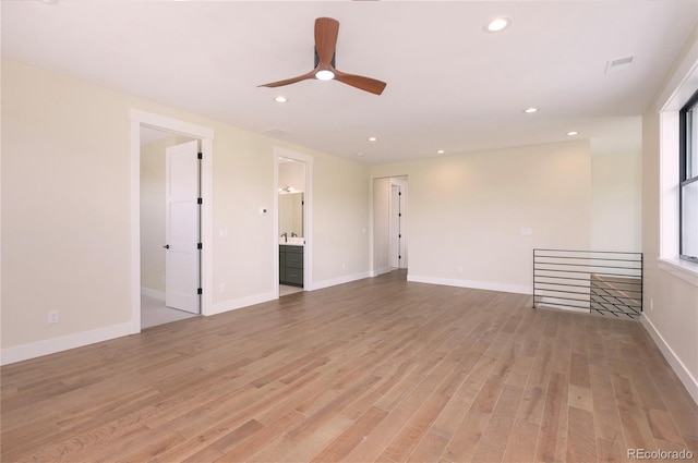 empty room featuring light hardwood / wood-style floors and ceiling fan