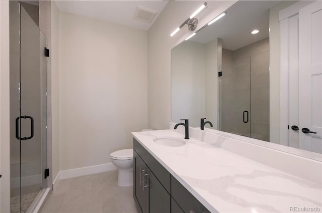 bathroom featuring walk in shower, tile patterned floors, vanity, and toilet