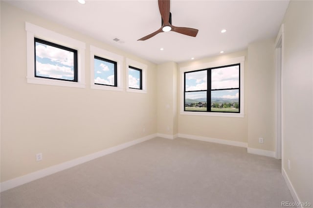 unfurnished room with carpet floors and ceiling fan