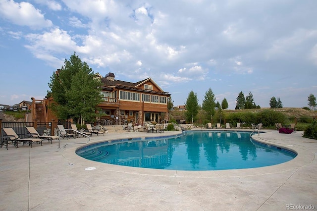 view of swimming pool with a patio