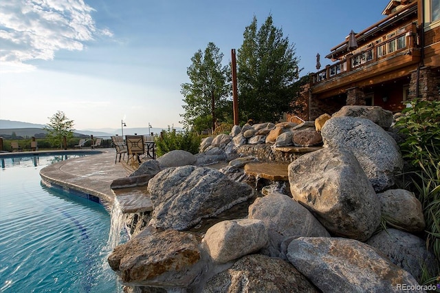 view of pool with a mountain view