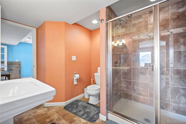 1929 Baguette Dr, Castle Rock, CO 80108 - bathroom with a stall shower, toilet, and baseboards