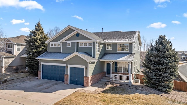 1929 Baguette Dr, Castle Rock, CO 80108 - view of front of home featuring a porch, brick siding, driveway, a garage, and roof with shingles