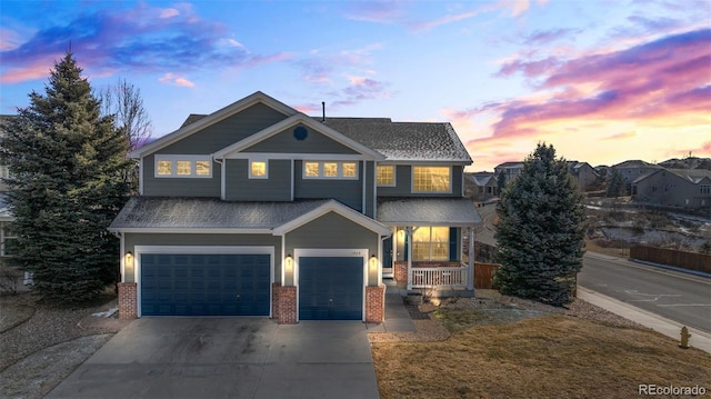 1929 Baguette Dr, Castle Rock, CO 80108 - view of front of home featuring a porch, a garage, brick siding, concrete driveway, and a shingled roof
