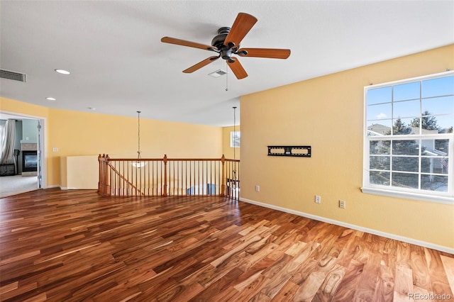 1929 Baguette Dr, Castle Rock, CO 80108 - spare room with a ceiling fan, wood finished floors, baseboards, and recessed lighting