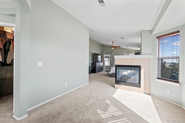 1929 Baguette Dr, Castle Rock, CO 80108 - unfurnished living room featuring vaulted ceiling, carpet floors, a fireplace, baseboards, and ceiling fan