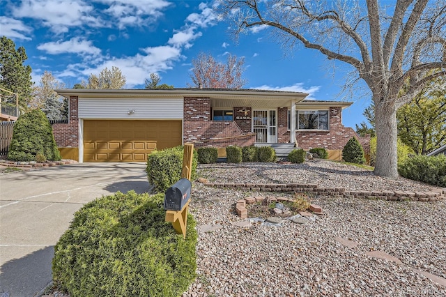 single story home featuring a garage and covered porch