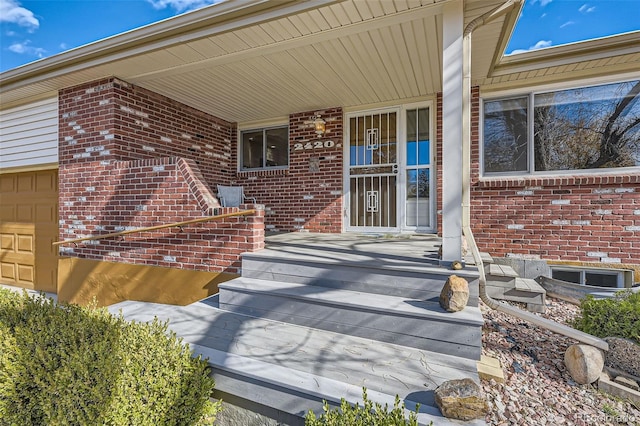 view of exterior entry featuring a garage