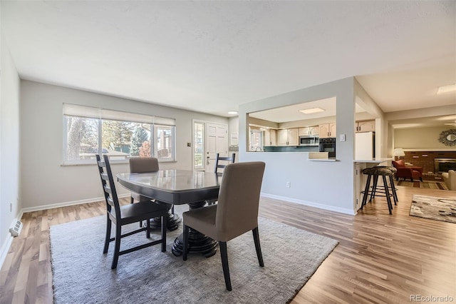 dining room with light hardwood / wood-style floors