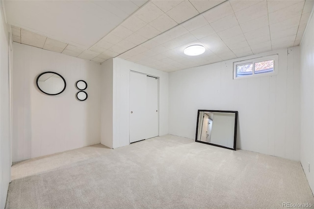 empty room featuring light colored carpet