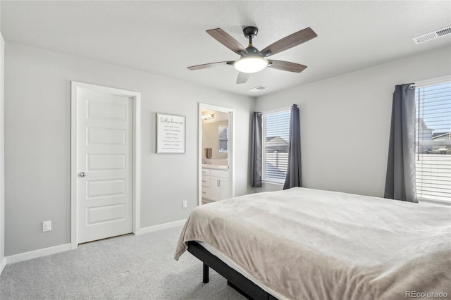 carpeted bedroom featuring ceiling fan and connected bathroom