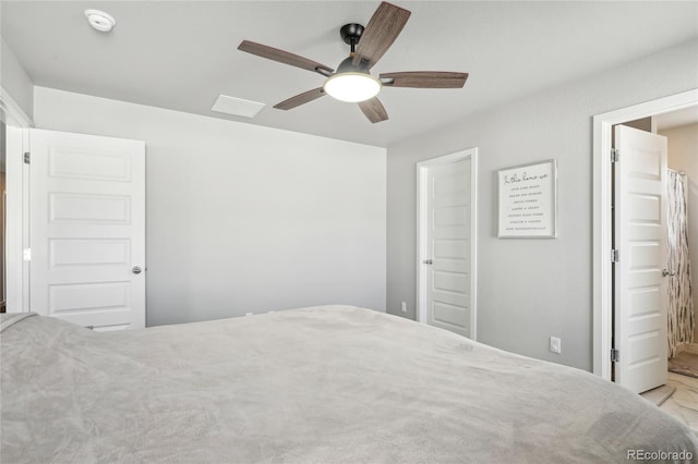 unfurnished bedroom featuring ensuite bathroom and ceiling fan