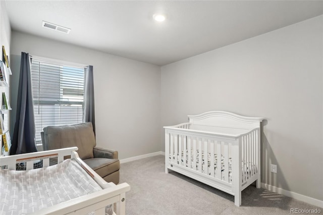 bedroom with light colored carpet