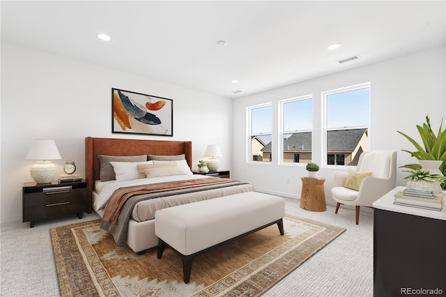 bedroom featuring recessed lighting, visible vents, light carpet, and baseboards